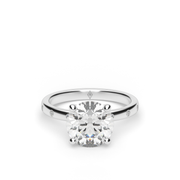 White Gold Round Shape Diamond Side Stone Engagement Ring With Burnish Setting.